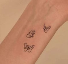 three butterflies tattoo on the wrist