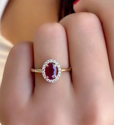 Ruby Gold Ring - Natural Ruby Gemstone Gold Ring - Dainty Gold Jewelry - Ruby Women Promise ring - Gift For Wife - Solitaire Ruby Ring *100% natural gemstone *14k solid gold *solid gold (NOT plated) *gemstone: ruby *gemstone: zircon *stone shape ruby: oval *stone shape zircon: round *stone ruby : 5x7 mm. *stone ruby ct. : 1.00-1.20 ct. *stones ruby : 1 pc. *stone zircon : 20 pcs. Gia Certified Oval Ruby Ring For Wedding, Fine Jewelry Ruby Ring With Halo, Fine Jewelry Ruby Ring With Halo Design, Yellow Gold Ruby Rings With Halo Design, Oval Ruby Ring With Diamond Halo, Formal Ruby Ring With Diamond Halo, Heirloom Ruby Ring Gia Certified As Gift, Heirloom Gia Certified Ruby Ring Gift, Exquisite Ruby Rings With Halo Setting