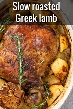 a roasting pan filled with potatoes, meat and rosemary garnished in gravy