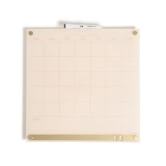 a clipboard with a pen attached to it on a white surface and blank space for writing