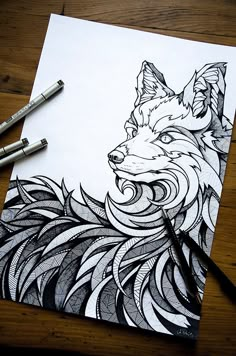 a drawing of a fox on paper with markers