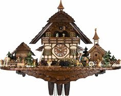 a wooden cuckoo clock with animals and trees on it's side, in front of a white background