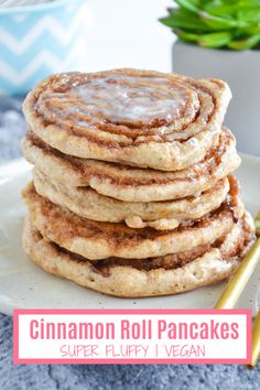 cinnamon roll pancakes are stacked on a plate