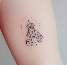 a small tattoo on the back of a woman's left arm with two bells