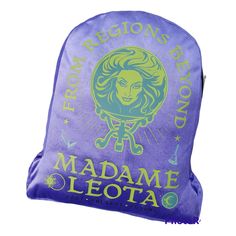 a purple backpack with the words madame leota on it and a woman's head