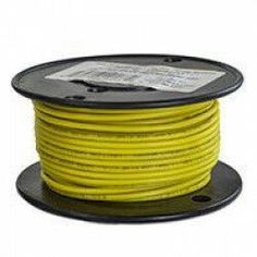 a spool of yellow wire on a white background