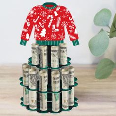 an origami christmas sweater with money on it