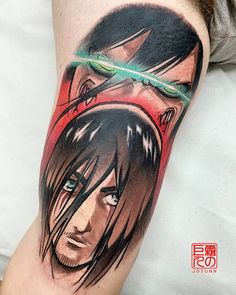 a man's leg with an anime tattoo on it