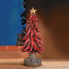 a christmas tree made out of chili peppers