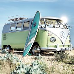 an old vw bus with a surfboard attached to it