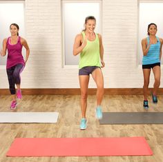 a group of women are doing exercises on mats