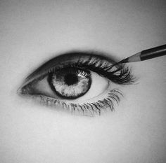 an eye with a pencil in it's center and the tip of its eyelashes