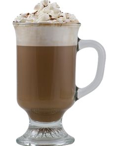 a tall glass mug filled with hot chocolate and whipped cream