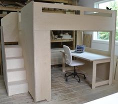 a loft bed with a desk underneath it and stairs leading up to the upper level