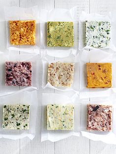 six different types of soaps in plastic bags on a white table top with some green and yellow flowers