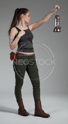 a beautiful young woman holding a bell in her hand