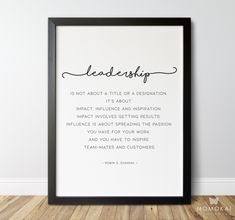 a framed print with the words, leader is not about a title or a destination