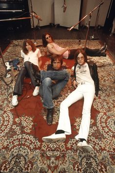 the runaways pose for a portrait in their living room