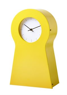 a yellow clock with a white face on it