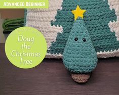 there is a crocheted christmas tree on the table