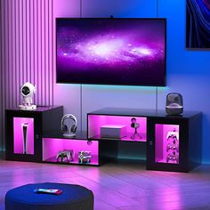 a living room with purple lighting and a flat screen tv