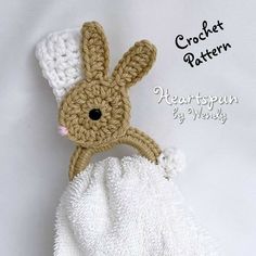 a crocheted bunny on top of a white blanket