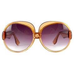 Beautiful and stylish vintage Mint Yves Saint Laurent 1970’s Oversized sunglasses in a translucent two tone amber frame holding a pair of Purple gradient lenses. This pair is an style statement. A great opportunity to achieve a unique and yet timeless look Made in France front 14 cms lens height 5.5 cms lens width 6 cms temples 11.5 cms 70s France, Vintage Yves Saint Laurent, Saint Laurent Sunglasses, Purple Gradient, Vintage Ysl, Naomi Campbell, Oversized Sunglasses, Pierre Cardin, Style Statement