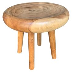 a wooden stool with two legs and a wood seat on the bottom is made out of natural wood