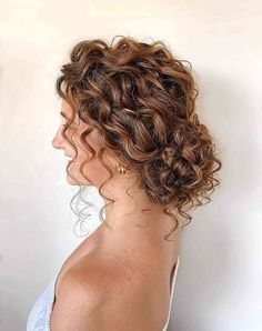 It’s time to wrangle your curly hair into a pretty updo. Which curly hair updo would work best on you? Let’s find out! #promhair Dark Curly Bridal Hair, Prom Hairstyles Naturally Curly, Naturally Curly Bridal Hair Half Up, Curly Braided Updo, Naturally Curly Wedding Hair, Curly Hair Updo Wedding, Curly Bridal Hair, Curly Hair Up, Bridesmaid Hair Inspo