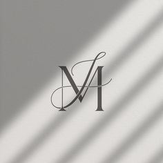 the letter m is made up of letters and lines on a gray background with shadows