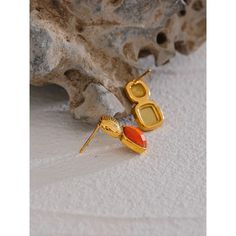 Aretha Orange Stud Earrings Vibrant Personality: The orange hue reflects boldness, energy, and an unapologetic sense of self. These earrings are a tribute to individuality and confidence, offering a striking accessory that commands attention and radiates positivity. Striking Gemstone: The carefully chosen orange gemstone adds a radiant pop of color to your ensemble. The Aretha Orange Stud Earrings feature a captivating design that embodies the spirit of energy and creativity. The vibrant orange Bold Orange Drop Earrings, Orange Party Earrings For Pierced Ears, Vibrant Orange Drop Earrings, Bold Orange Party Jewelry, Bold Drop Earrings Jewelry Gift, Modern Orange Drop Earrings, Trendy Orange Dangle Earrings, Minimalist Orange Drop Earrings, Trendy Orange Drop Earrings