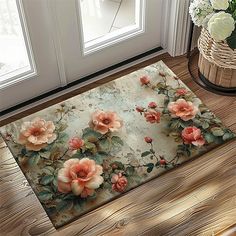 a door mat with pink flowers on it