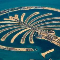 an aerial view of the palm island in the middle of the ocean, taken from above