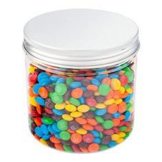 a glass jar filled with lots of colorful candy