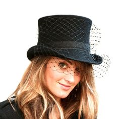 Black woman top hat made with wool or fur felt and embellished with black veil. Wearing this hat provides elegance and glamour and creates a mysterious and interesting look. Ideal for special occasions such as weddings, cocktails or parties.Measurements in centimeters are 26 x 24. Crown height 11,5. Brim length 5.5 in front and 4 behind. These measurements may have some slight variation depending on the size of the hat.For its elaboration we only use very good quality and resistant wool and rabb Black High Crown Headpiece For Wedding, Formal Black Winter Top Hat, Black Top Hat For Kentucky Derby Church Occasion, Black High Crown Costume Hats And Headpieces For Wedding, Black High Crown Costume Hat For Wedding, Winter Formal Black Costume Hats And Headpieces, Formal Black Costume Hats For Winter, Black Formal Winter Costume Hat, Formal Black Winter Costume Hat