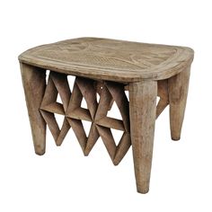 a small wooden table with geometric designs on it's legs and bottom section, made out of wood