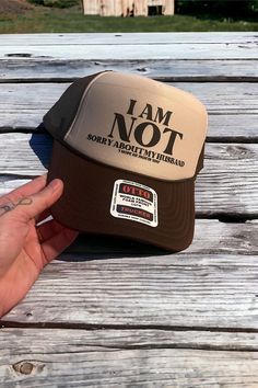 I kept seeing so many "I am Sorry About My Husband" hats this year, and I was BAMBOOZLED.  Sorry?  I'm not sorry at all!  This   Foam high crown trucker hat is the perfect accessory for any outdoor enthusiast. Made with a durable foam material, this hat offers a comfortable and breathable fit. The high crown design provides ample space for large heads, hair, or high sittin'. The mesh back allows for ventilation, ensuring that you stay cool and comfortable on even the hottest days. The adjustable I Love My Husband, Trucker Humor, Not Sorry, Outdoor Enthusiast, Crown Design, Love My Husband, Girl With Hat, Hot Days, Terry Cloth