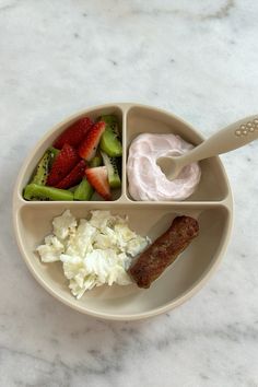 a white plate topped with three compartments filled with food