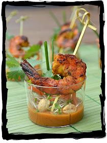 a small glass bowl filled with food on top of a table