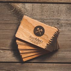 wooden business cards with the logo axemen on them