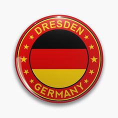 a button with the german flag and stars in red, yellow and black on it