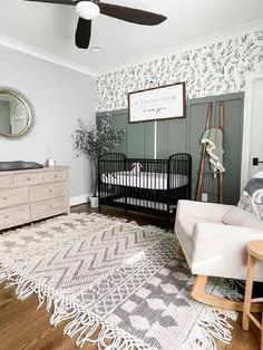 a baby's room with a crib and dresser