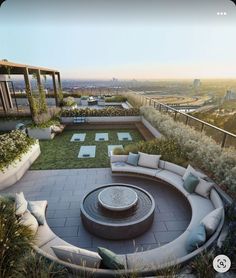 an outdoor seating area on top of a building with lots of greenery and plants