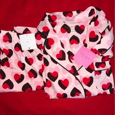 Kate Spade Pajama Set Large Pink Double Hearts Valentine's. Nwt. New With Tags Kate Spade New York Women's Long Sleeve 2 Piece Pajama Pant Set 90% Polyester 10% Elastane Jersey Knit Fabric Solid Pink With Black Trim Double Heart Logo Print Pink Kate Sade Logo Buttons Notched Collar 1 Chest Pocket Elastic Waist Pant Non-Cuffed Hem Size: Large New // Never Worn Before Please Refer To Picture And Ask Any Questions. Pit To Pit: 21" Shoulder Down: 23" Arm Length: 23" Rise: 12.5" Waist: 16" Length: 38 Pink Sleepwear For Valentine's Day, Pink Valentine's Day Sleepwear, Pink Sleepwear For Valentine's Day Pajama Party, Valentine's Day Sleepwear With Heart Print For Sleepover, Valentine's Day Heart Print Sleepwear For Sleepover, Red Heart Print Sleepwear For Valentine's Day, Valentine's Day Heart Print Sleepwear, Red Heart Print Sleepwear For Pajama Party, Kate Spade Pajamas