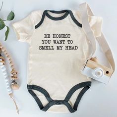 Dress your little one in laughter with this Funny Baby Bodysuit! Perfect for newborns and infants, this adorable and humorous bodysuit is made from soft, high-quality fabric, ensuring comfort and cuteness. Ideal for baby showers, everyday wear, or as a playful gift, this bodysuit brings joy and smiles wherever your baby goes. Make a statement with this charming and comical outfit! This baby bodysuit is machine washable, making it easy to care for. The romper is super soft and easy to wear and take off, with a snap closure. This bodysuit is designed and created by a mom who is passionate in creating playful, cute, and trendy design. 100% handmade with love and care for your little one! ✅ PRINTING TECHNOLOGY: Direct to Garment printing, full-color digital printing, bright colors, realistic p Birthday Baby Announcement, Traditional Baby Clothes, Funny Baby Shirts, Clothes Print, Personalized Baby Clothes, Funny Baby Clothes, Funny Baby Onesies, Newborn Outfit, Pregnancy Reveal