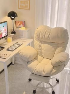 a chair that is sitting in front of a computer