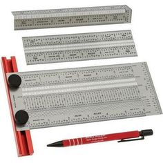 a ruler, pen and marker are sitting next to each other