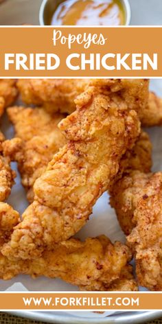 fried chicken on a white plate with dipping sauce in the background and text overlay that reads, pope's fried chicken