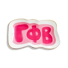 a pink and white plate with the word bob painted on it's bottom half