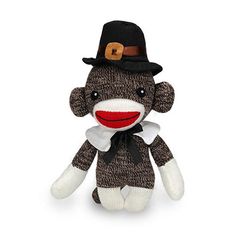 a sock monkey with a top hat and bow tie on it's head is sitting